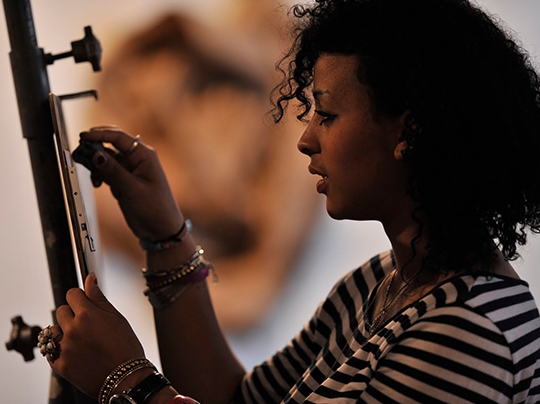 undergraduate visual arts student drawing in a studio