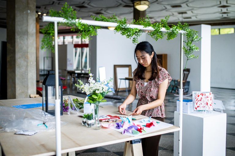 Mina Chung (CFA’23) sets up her thesis exhibit ahead of the 2023 BFA Graphic Design Thesis Exhibition at the 808 Gallery.