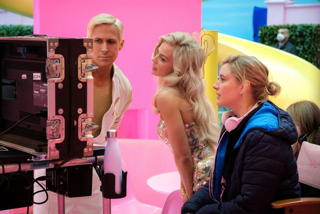 Ryan Gosling as Ken (from left), Margot Robbie as Barbie, and director Greta Gerwig on the set of Barbie.