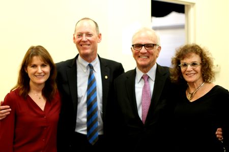 Dean Natalie McKnight, Dr. Paul Farmer, Stanley Stone (64, Questrom 66), and Sharna Striar pose for a photo before the event.