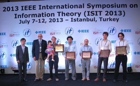 ComSocAward-486x300 In July, Assistant Professor Bobak Nazer (ECE) and Professor Michael Gastpar of EPFL and UC Berkeley received a 2013 Joint Paper Award from the IEEE Communications Society and IEEE Information Theory Society. Pictured from left at the Istanbul award ceremony are Professor Edmund Yeh, Secretary of the Board of Governors of the IEEE Information Theory Society; Professor Abbas El Gamal, First Vice President of the IEEE Information Theory Society; fellow winners, Professors David Tse (UC Berkeley), Suhas Diggavi (UCLA), and Salman Avestimehr (Cornell); Gastpar and Nazer.