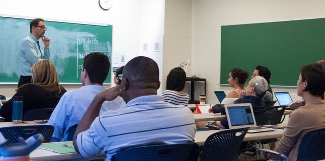 Graduate students, mostly practitioners, listened carefully during the workshop