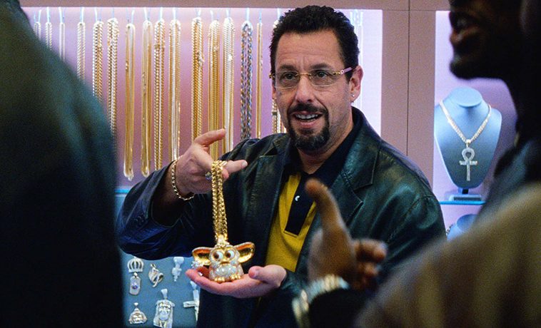 An expensively bedazzled Furby is one of the many hustles Adam Sandler’s character is running in the new Safdie Brothers film, Uncut Gems.