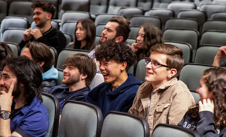 Students laughing at performance