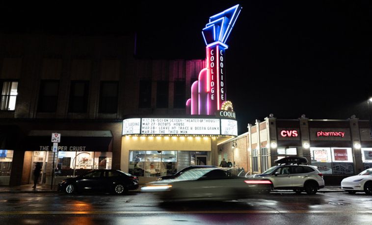 The Coolidge Corner theater lit up at nighttime