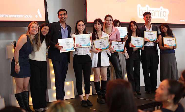 Winners of the AdLabbies standing on stage with their awards