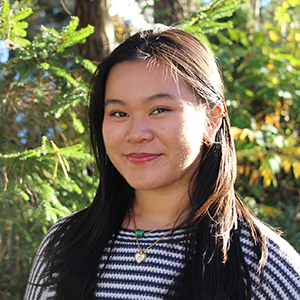Smiling portrait with trees in background