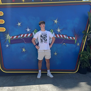 Full body portrait with blue mural