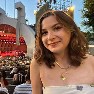 Smiling portrait with concert venue background