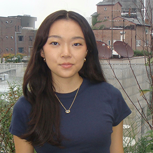 A photo of Dabi Lee standing on the street.