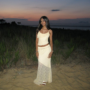 A photo of Raahi Mehta standing on the seashore.