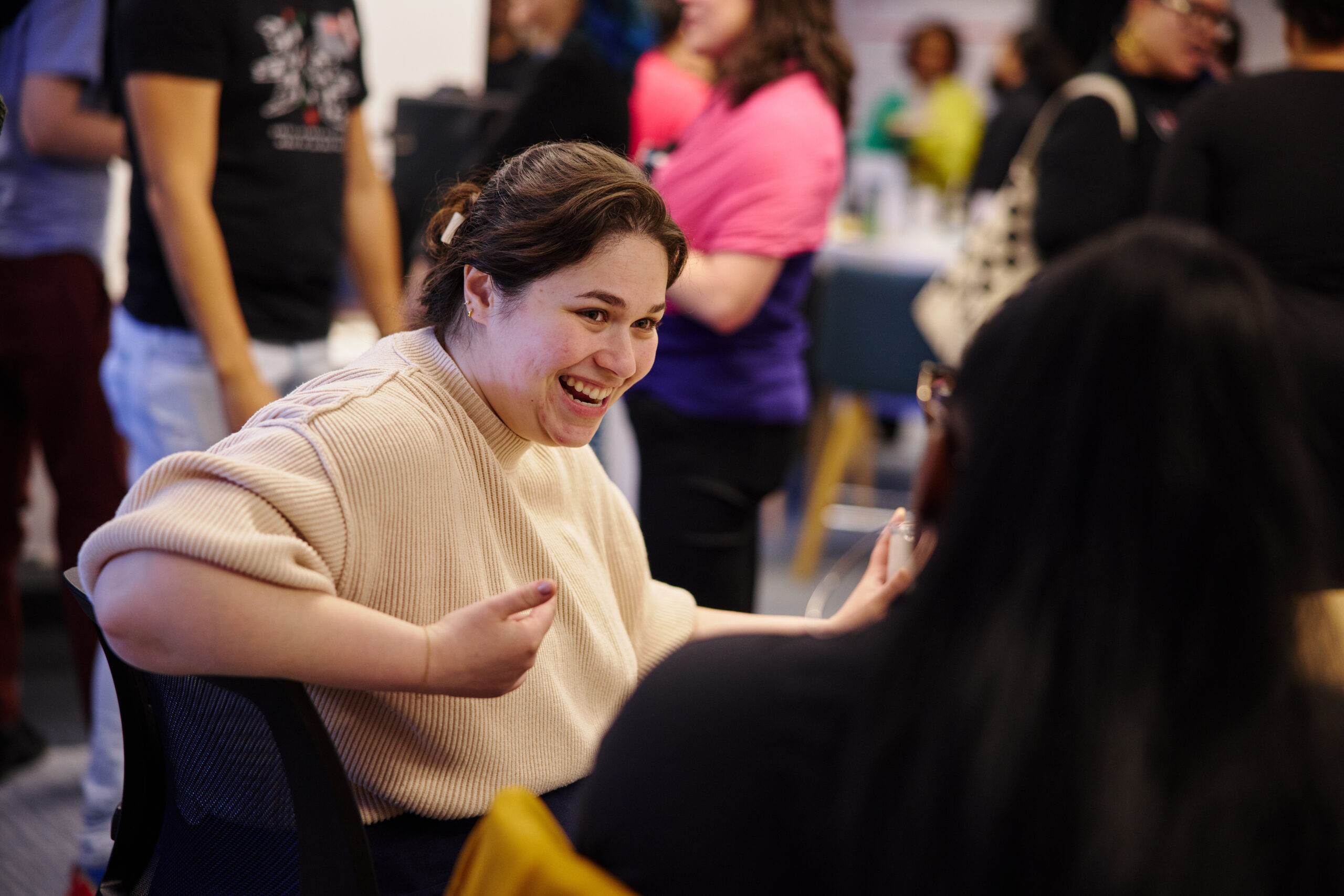 BU staff member laughing at a grand opening event