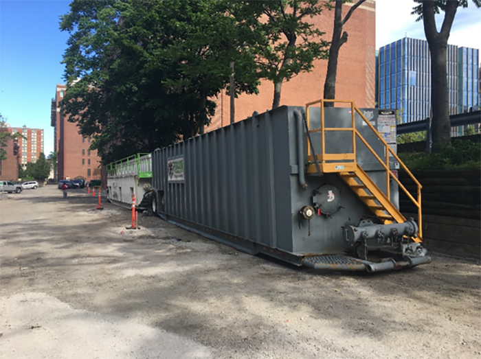 View of water storage settling tanks mobilized in the alleyway