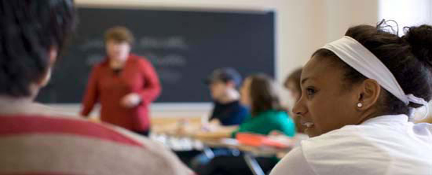 View from back of classroom of students in discussion