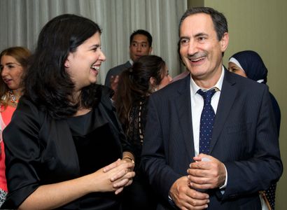 Drs. Eleni Kanasi and Serge Dibart mingle at the reception