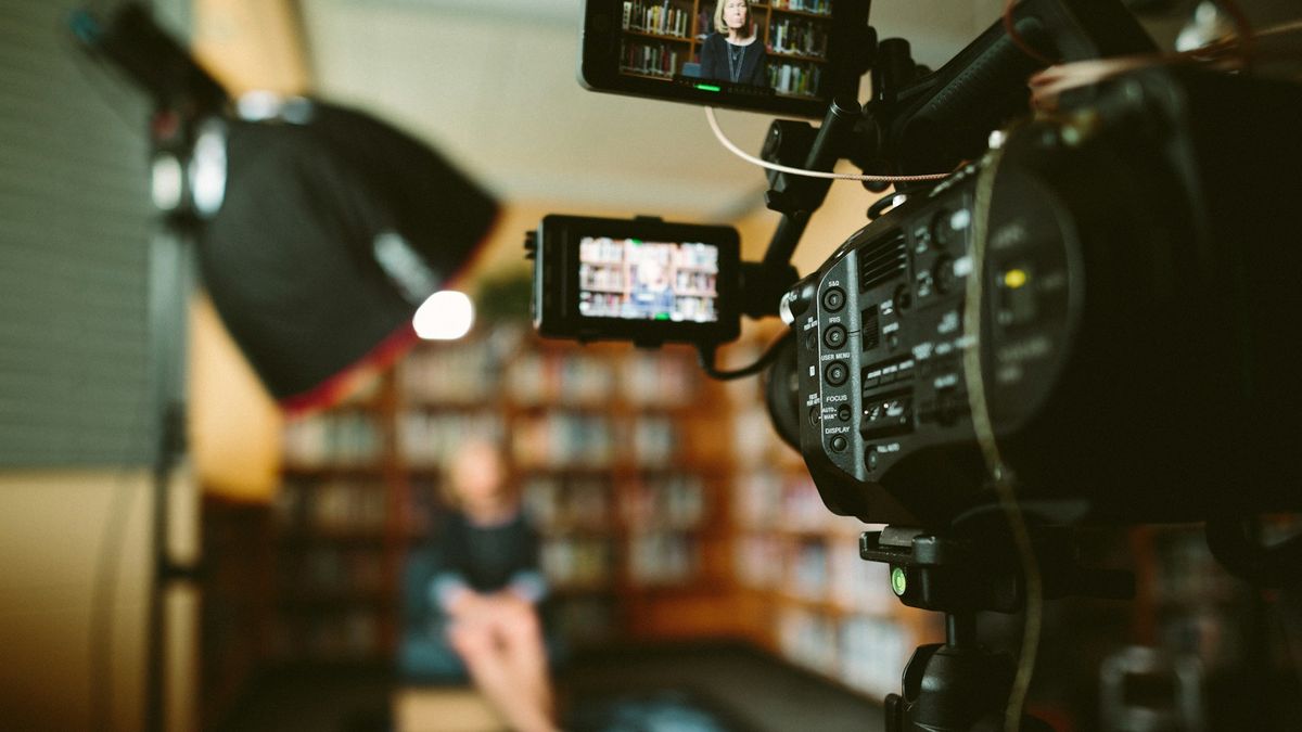 A media set up with a camera focused on someone for an interview