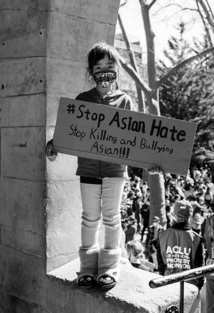 Child holding sign #Stop Asian Hate Stop Killing and Bullying Asian!!!