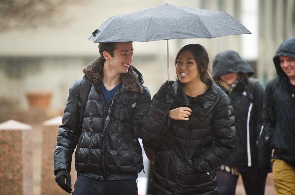 Brad Ferber (CGS'17) and Elaine Choung (CGS'17) make their way form a class at SMG to one at CGS in the middle of the nasty weather along Commonwealth Avenue December 10, 2014. 