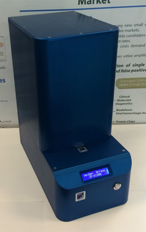 NexGen Arrays prototype of SP-IRIS, which detects pathogens by shining light from multicolor LED sources on viral nanoparticles bound to the sensor surface by a coating of virus-specific antibodies. Image courtesy of NexGen Arrays