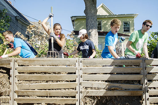 First Year Student Outreach Project (FYSOP) volunteers do some compost work at Nightingale Community