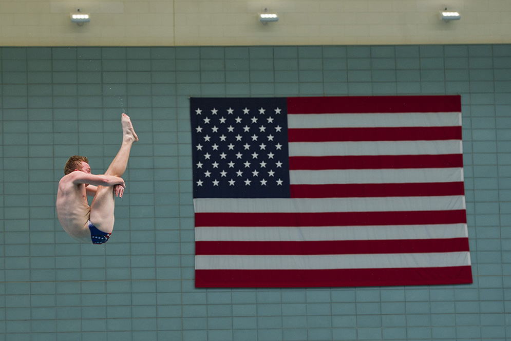 David Thiede (ENG'19) works on a forward two-and-a-half somersault pike during BU's Swimming and Diving team practice at FitRec October 7, 2015. The team practices six times a week at the pool and lifts an additional three times a week.