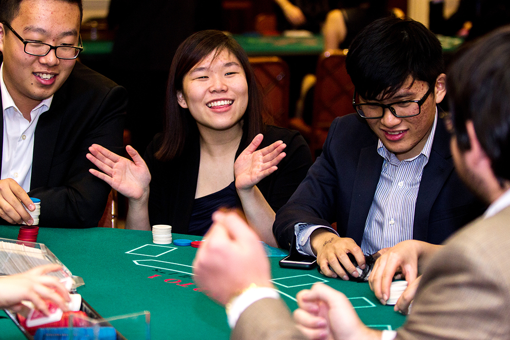 Maggie Zhang (Questrom '19) reacts during a card game at Questrom's Casino Night Fundraiser Friday night in the Trustee Center. Photo by Alexandra Wimley (COM'16)