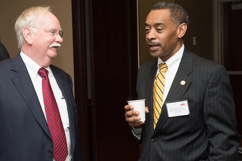 Brown (left), with Woodson at Thursday’s panel discussion on brain injuries.