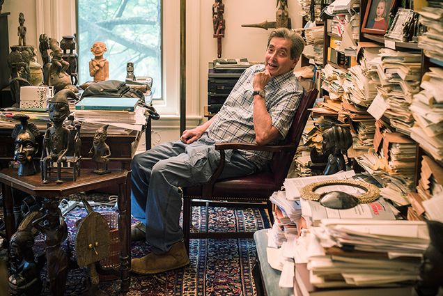 Stephen Grossberg sits on a chair in his home in Newton