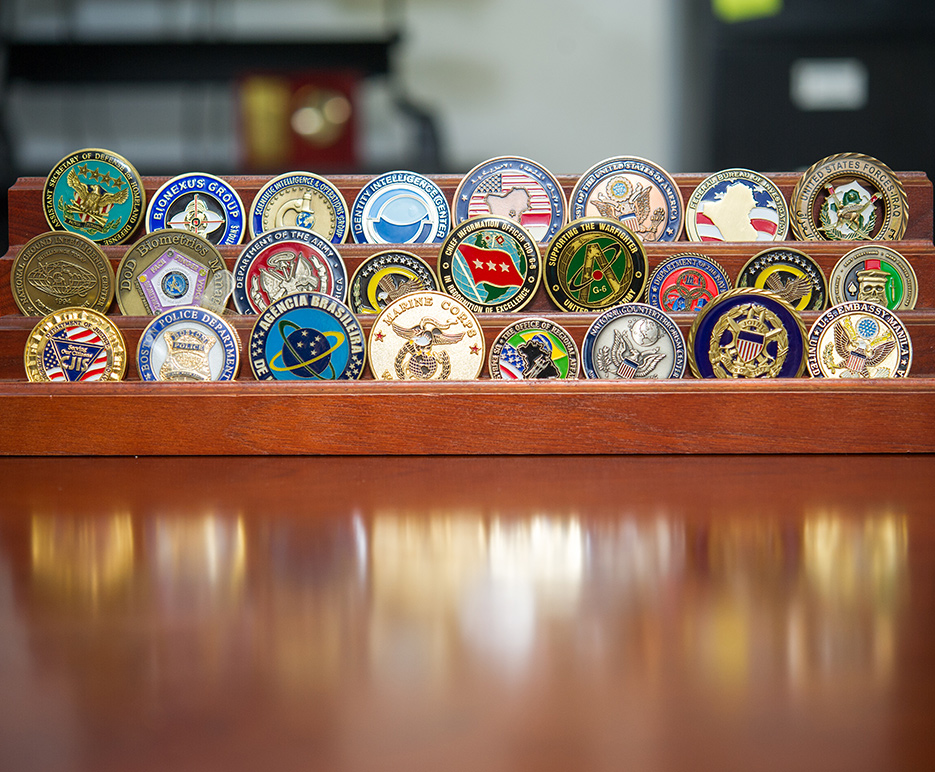 Challenge coins displayed in the office of John Woodward, professor of international relations at Boston University Pardee School of Global Studies