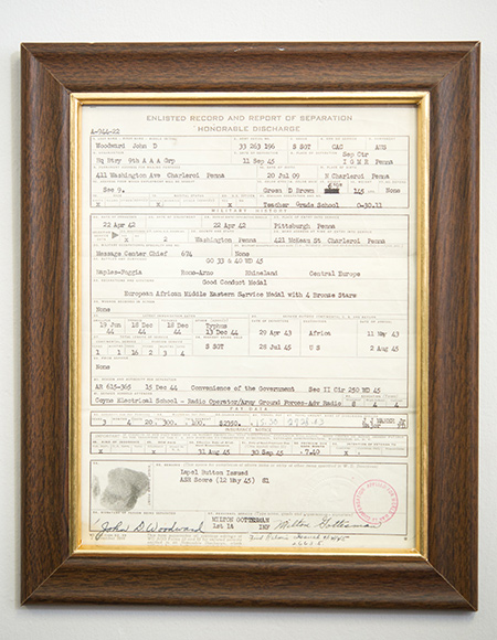 Honorable Discharge Papers from the American military belonging to John Woodward's father, displayed in the office of John Woodward, professor of international relations at Boston University Pardee School of Global Studies