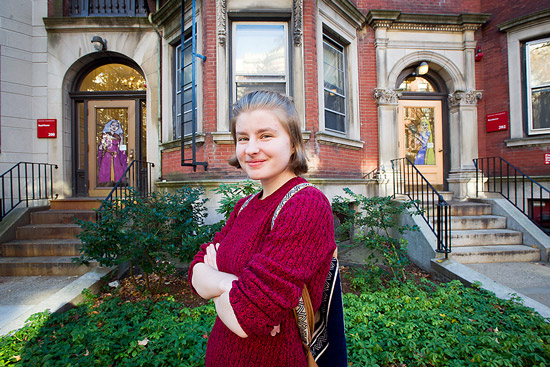 Daria Lugina in front of painted doors