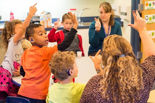 deaf children participate in a American Sign Language class