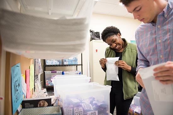 Lauren Banks (CGS’17) and Jared Lawson (ENG’18) fill Condom Fairy orders in their role as Student Health Ambassadors.