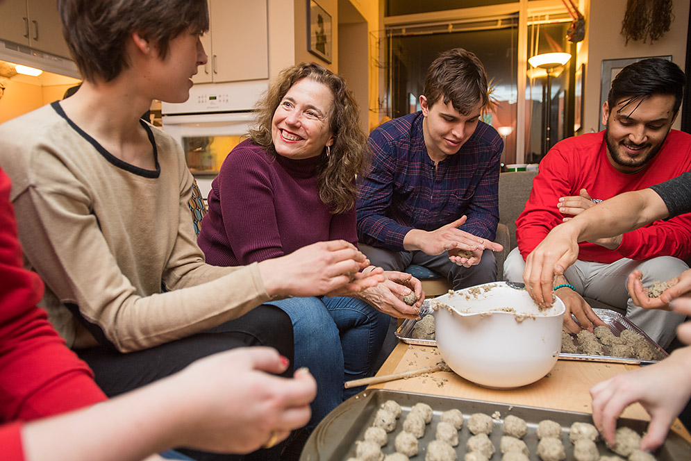 Karen Jacobs making cookies with students