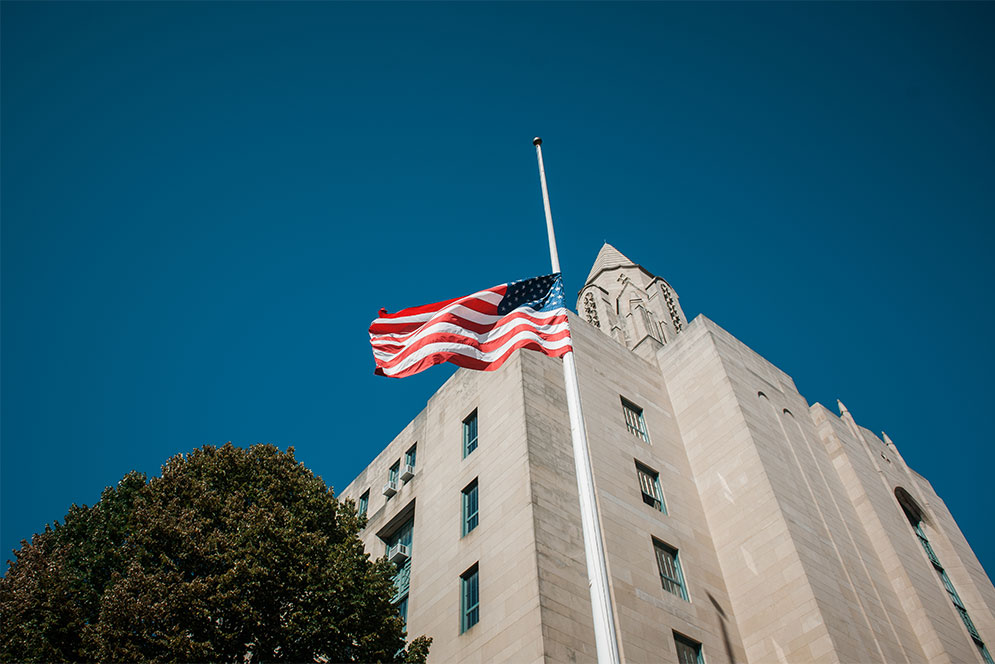 The United States flag on Boston University's Marsh Plaza flies half mast in recognition of Las Vegas shooting.