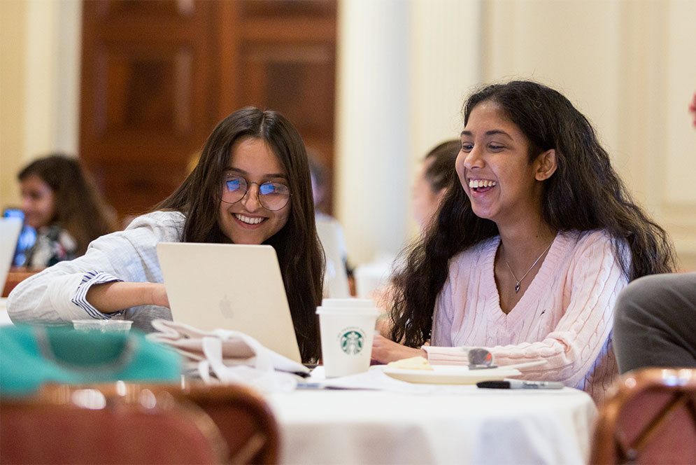Students work on code during the Hack the Gap two-day hackathon event organized by Girls Who Code BU