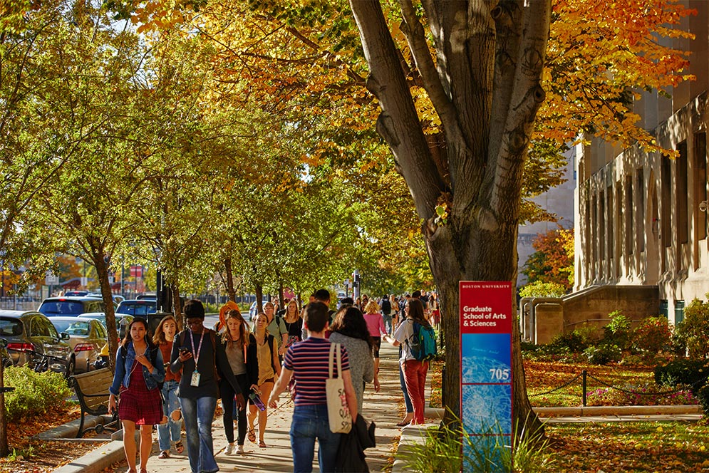 Autumn view of Boston University students walking along Commonwealth Ave.