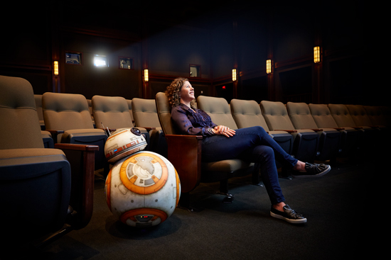 Janet Lewin (CGS’90, COM’92), with droid BB-8 in a screening theater at Lucasfilm in San Francisco, takes Star Wars’ groundbreaking visual effects from ambitious ideas to fully executed realities. Photo by Mitch Tobias