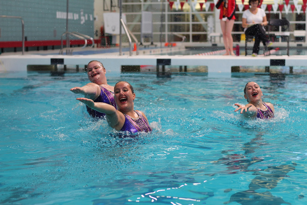 Participants in a BU synchronized swimming meet.