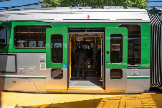 The open sliding doors of a new MBTA Green Line car.