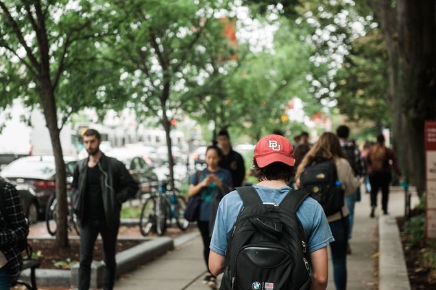 students walk down commonwealth ave