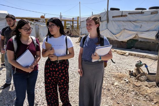 Misty Ouyang, Jessica Thai, and Sheila Phillips speak while visiting the Saadnayel settlement in Bekaa Valley, Lebanon