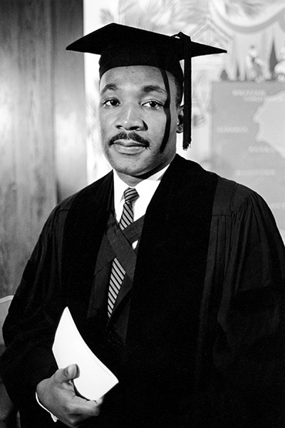 Portrait of Martin Luther King, Jr. in graduation robe and gown to receive an honorary degree from Boston University in 1958.
