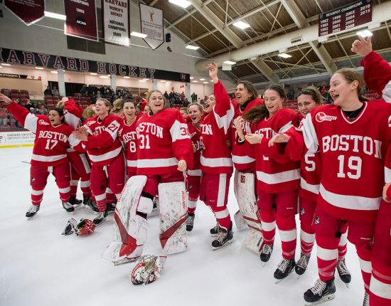 BU women's ice hockey team celebrates winning the 41st annual Beanpot tournament championship while be serenaded by the BU Pep Band.
