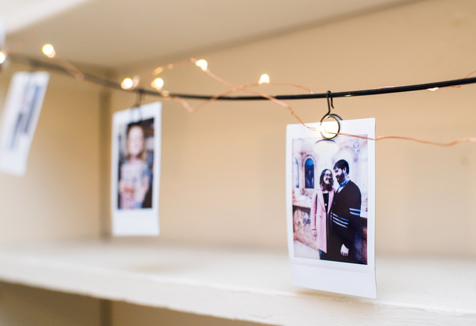 Natalie decorates her room with polaroid pictures