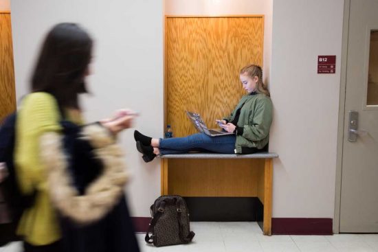 Avery Pelosi (CAS'22) waits for the start of her psychology class in the basement of CAS