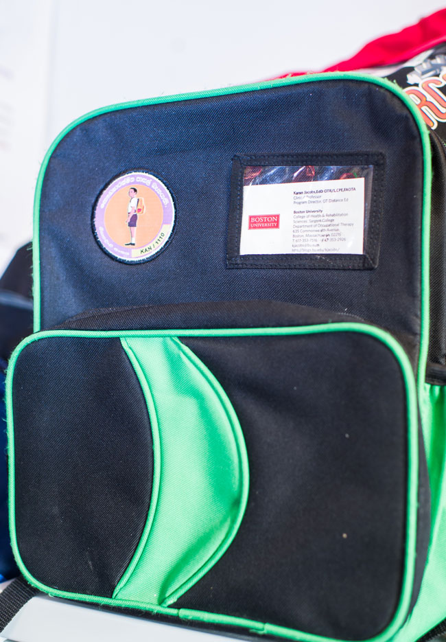 a green and black backpack