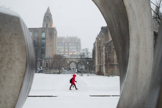A student walks to class in the snow
