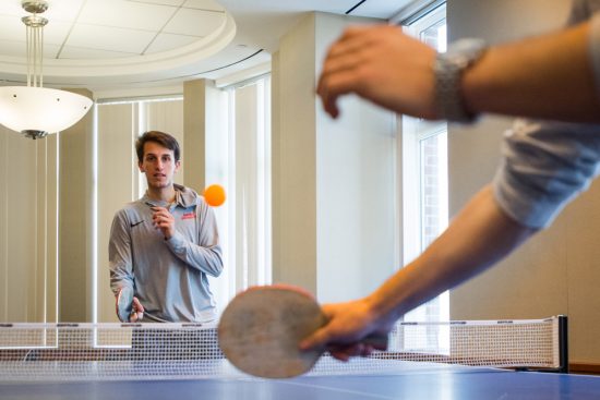Two students play table tennis