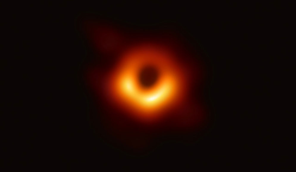 The first direct visual evidence of the supermassive black hole in the center of Messier 87 and its shadow. The shadow of a black hole seen here is the closest we can come to an image of the black hole itself, a completely dark object from which light cannot escape. Credit: EHT Collaboration